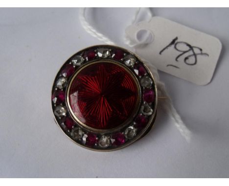 Good circular red enamel and diamond  gold mounted brooch 2.5cm dia     