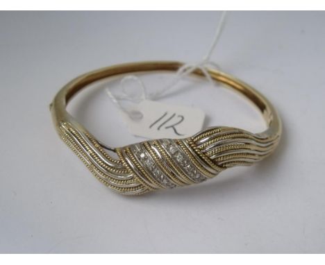 A HEAVY 18CT GOLD DIAMOND SET  bangle 23g        