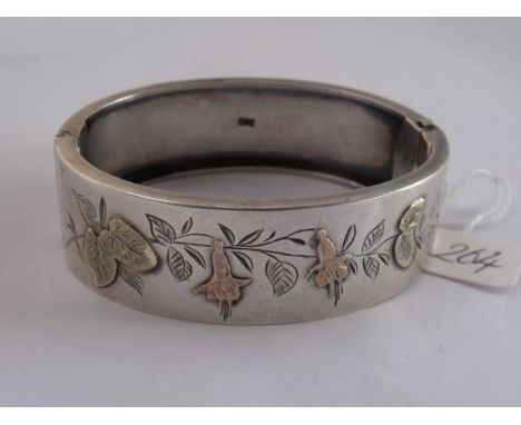 Is another wide bangle with flower overlay  marked 'Standard Silver' 25g      