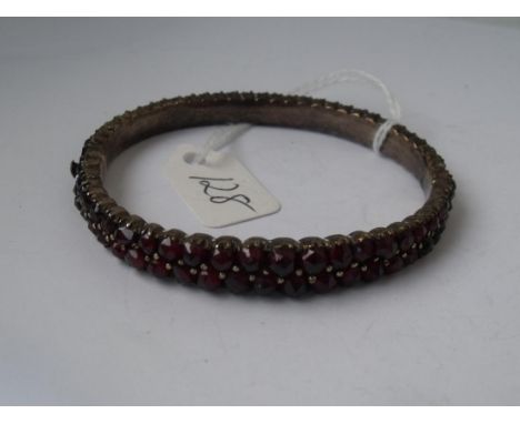 An antique garnet bangle      