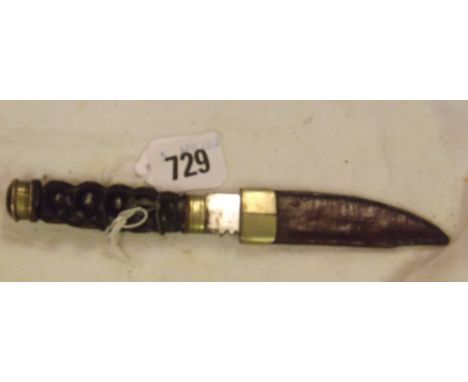 Skein Dhu with carved wooden  handle decorated with Celtic strapwork    