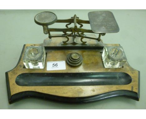 A late Victorian walnut deskstand, incorporating postage scales and two glass inkwells  12''w         OS1