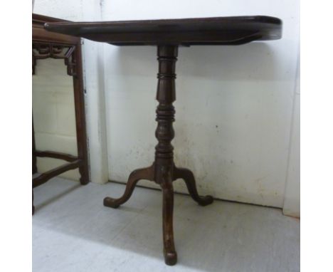 A late Victorian mahogany pedestal table, raised on a tripod base  27''h  22''w         BSR