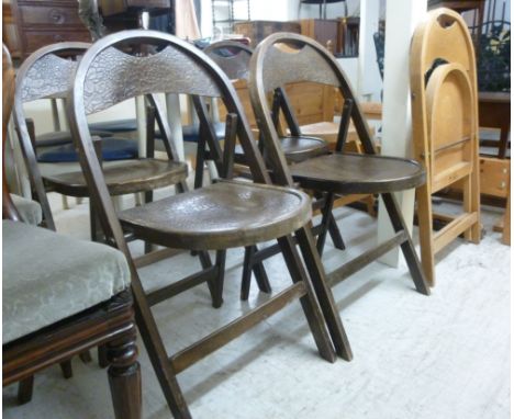 A set of four stained beech framed folding chairs, raised on rectangular legs; and a pair of light beech framed chairs       