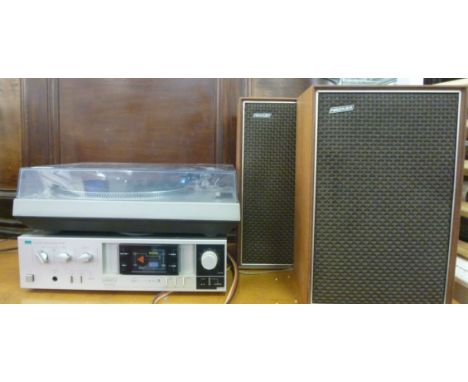 A Technics silvered steel cased record deck, a Samsui A-510 amplifier and a pair of Hacker, teak cased speakers  16''h       
