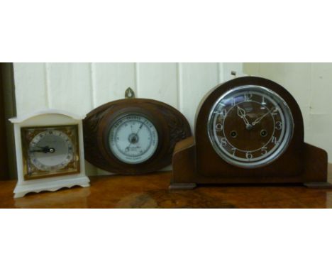 Clocks: to include a modern Hester-Clarke onyx cased mantel clock; the movement faced by a Roman dial  7''h        LAB