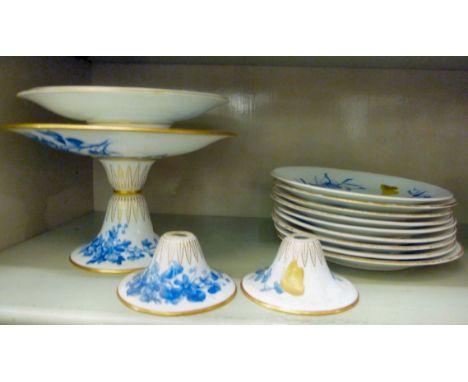 A Royal Worcester china dessert service, decorated in blue and white with floral ornament and gilding          OS6