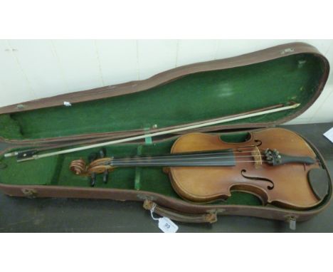 A violin, the two part back 14''L with a bow, in a fitted case           CB