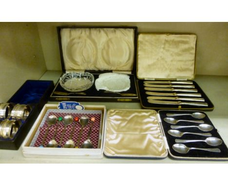 A set of six silver plated teaknives on silver handles  Sheffield 1936  cased; two glass butter dishes and a pair of silver k