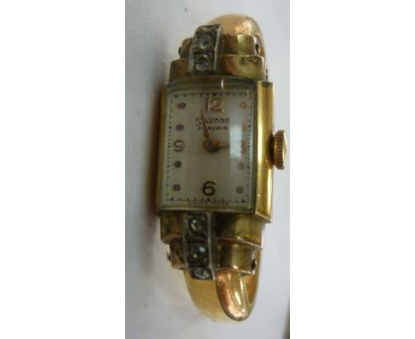 A lady's Sylvana yellow metal cased cocktail watch of Art Deco design, faced by an Arabic and button dial, on a sprung bracel