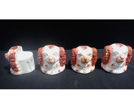 TWO PAIRS OF RARE STAFFORDSHIRE FURNITURE FEET/WINDOW PROPS modelled as spaniel's heads with fluted column backs, typically p