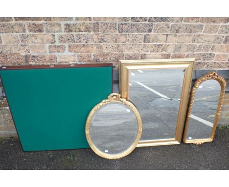 THREE GILT FRAMED MIRRORS two shaped with moulded frames, and one larger rectangular 80 x 57cm (all modern), and a modern fol