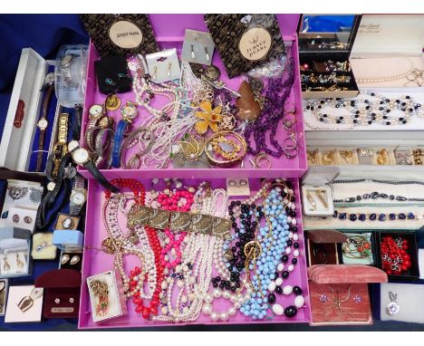 A QUANTITY OF COSTUME JEWELLERY and watches, including 'Jersey Pearl' items, beads, vintage brooches etc