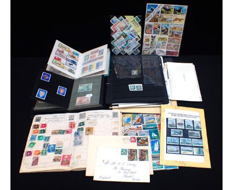 STAMP AND FIRST DAY COVER ALBUMS including a Hitler Ukraine Colony stamp, together with some loose stamps and envelopes.