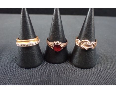 A 9CT AND GARNET RING And three other rings (4)