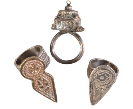 THREE WHITE METAL TRIBAL RINGS comprising two Al Shadad rings and one Zar Ceremony ring, 43g combined gross (3)