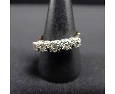 A FIVE STONE DIAMOND AND GOLD RING 