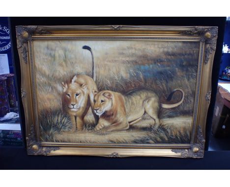 20th CENTURY, TWO LIONS HUNTING oil on canvas 61 x 92cm, gilt swept frame 