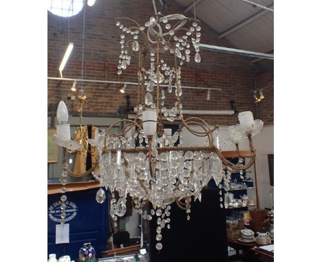 A CHANDELIER WITH PRISMATIC DROPS of traditional shape, six branches, approx 70cm wide, 65cm drop (needs attention, incomplet