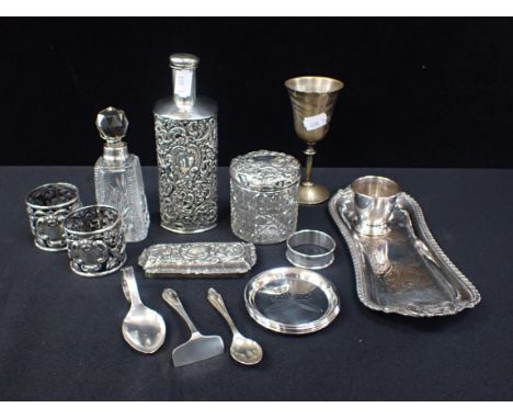 A LATE VICTORIAN SILVER COVERED GLASS BOTTLE London 1898, a pair of similar napkin rings, silver-mounted bottle, a lid, jar a