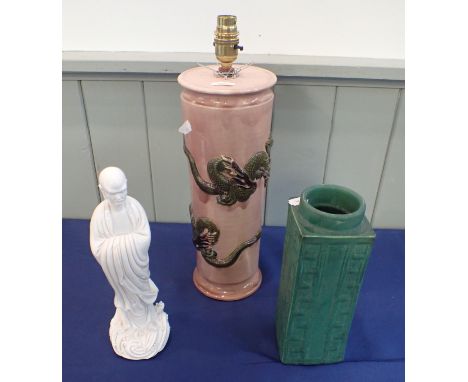 A PINK GLAZED TABLE LAMP WITH RAISED DRAGON DECORATION with a green matt glazed slab vase and a blanc de chine Asian figure