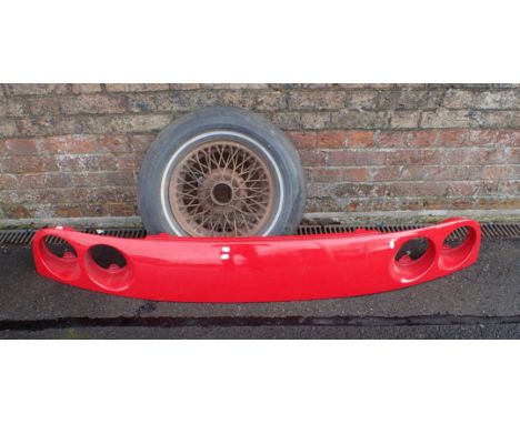 A FERRARI REAR BODY PART badge removed, with four rear light apertures, approximately 168cm long, together with a wired car w