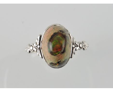 A matrix opal, on a white metal band stamped Silver, 2.5g.