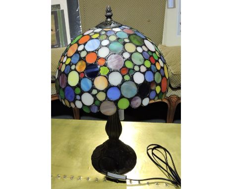 A Tiffany style bronzed table lamp with leaded coloured glass shade, H. 44cm.