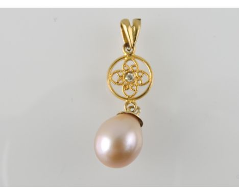 A pink pearl and diamond-set pendant, the drop suspended from a filigree disc, 1.6g.