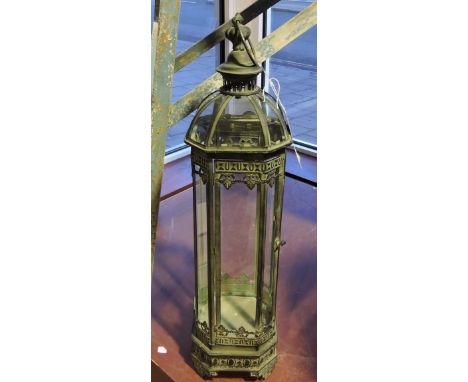 A vintage style verdigris metal glazed hexagonal tall lantern, H. 76cm.