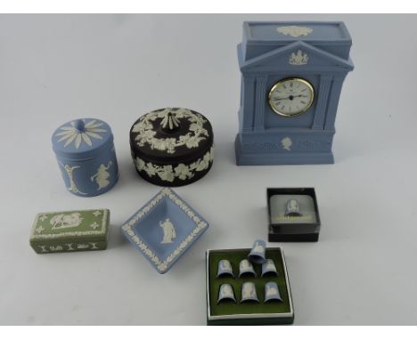 A Wedgwood blue jasperware mantel clock of portico form, H. 21cm, together with a small quantity of sundry items of jasperwar