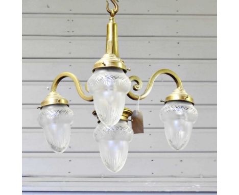 A brass three branch ceiling light, with cut glass shades, 50cm diameter