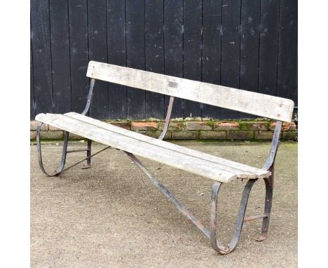 A wooden garden bench, on a metal base bearing a plaque inscribed Stand Q Lords Cricket Ground, 1936-1989, 183cm