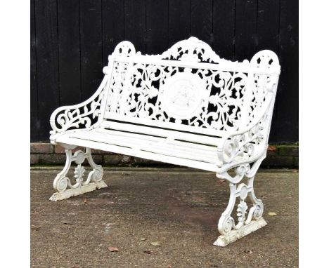 An ornate white painted cast iron garden bench, with scrolled decoration156w x 62d x 99hcm