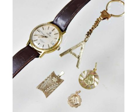 A 9 carat gold pendant, together with two others, a vintage Roamer Searock gentleman's gold plated wristwatch and a keyring