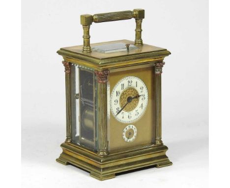 A 19th century brass cased carriage clock, the case flanked by columns, the enamel dial signed J E Ellis &amp; Co., Toronto, 