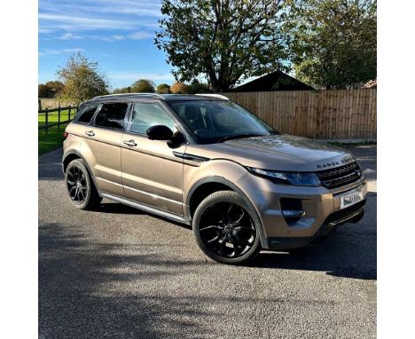A 2015 Range Rover Evoque, brown, petrol, 64,000 miles, with a brand new engine in 2023 at 60,000 miles, MOT October 2025, au