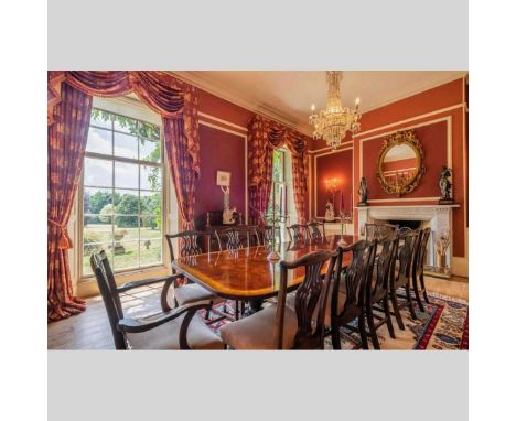 A good quality reproduction and satinwood crossbanded extending dining table, with two additional leaves, together with a set