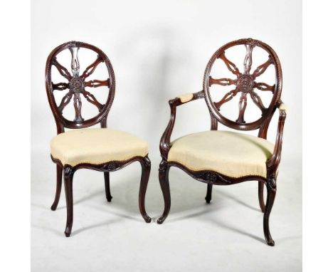 A set of eight Chippendale style upholstered dining chairs, 20th century, each having a fan back and cream upholstered seat, 