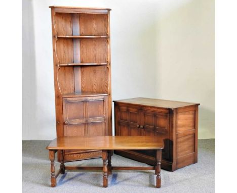 An Ercol elm side cabinet, 98cm wide, together with a matching corner cabinet and an Ercol coffee table (3)98w x 50d x 70h cm