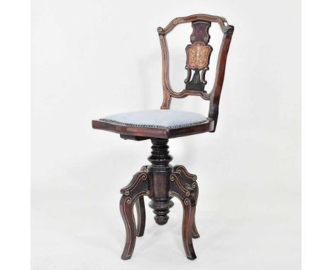 An Edwardian inlaid music chair, with a revolving seat. Note: a non-transferable ivory exemption certificate has been granted