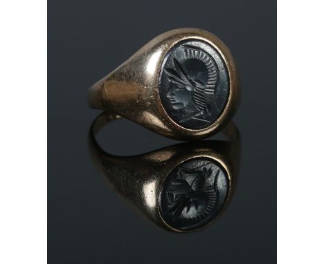 A 9ct Gold Hematite Intaglio signet ring. Inscription on the inside of the band '14/9/63 Myra-Charles' Size R. Total weight: 