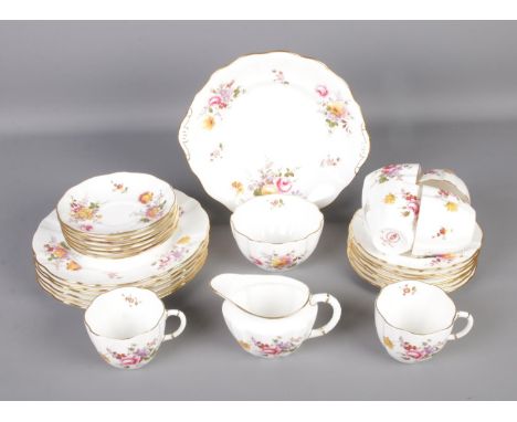 A Royal Crown Derby tea service in the Derby Posies pattern. Includes milk jug, sugar bowl, teacups, etc. Approx. 28 pieces. 