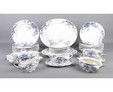 A comprehensive collection of 'Flora' K &amp; Co Late Mayers dinnerwares, with blue and gilt detailing. To include serving di