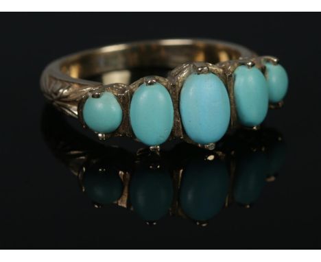 A 9ct Gold and five stone turquoise ring. Size O. Total weight: 4.3g.  
