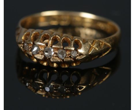An 18ct gold and five stone diamond ring. Size M, 2.31g.  