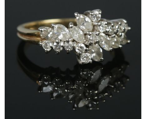 An 18ct gold ring set with marquise and brilliant cut diamonds. London import marks. Size P. 5.08g.  