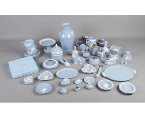 A large collection of Wedgewood Jasperware to include tea cups and saucers, table lighters and cake stand.  