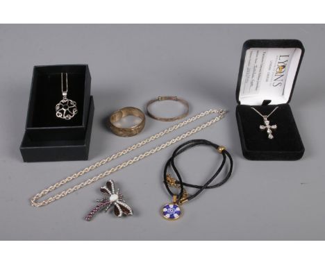 A quantity of jewellery, mainly silver. To include 'Jubilee Cross' on chain, christening bangles and spiral pendant on chain.