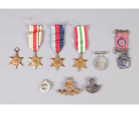 A collection of medals including the Italy star medal, the Africa star medal, a pair of the 1939 -1945 medals, George VI 1939